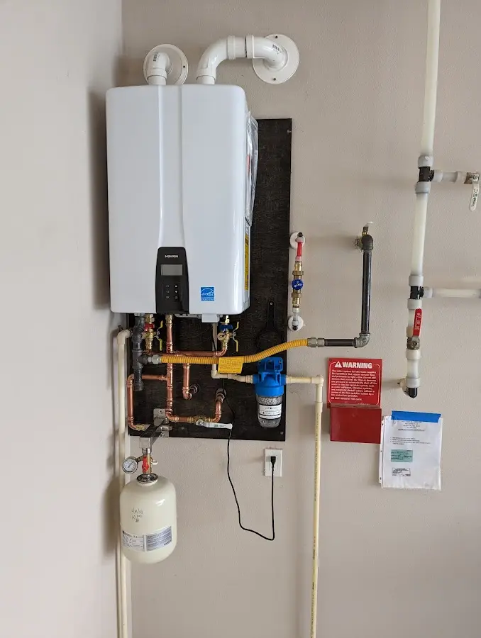 Professional plumber installing copper piping in a Buckeye home